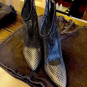 Sexy booties. Looks great with jeans or dress. Only worn once.